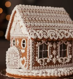 a close up of a gingerbread house on a table