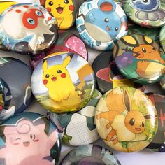 a bunch of buttons with different pokemon pictures on them