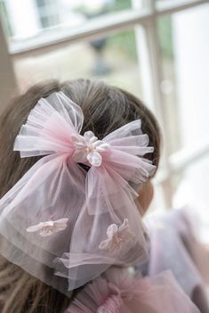 Petite Maison Kids. Pink tulle hair bow with handmade flowers and beading in the center. Made to match our Eva Collection. Comfortable hair clasp in the back. Suitable for 1 year and older. Measures approximately 5" x 8". Tulle Hair Bow, Tulle Hair Bows, Hair Clasp, Pink Tulle, Signature Design, Handmade Flowers, Flower Making, Hair Bow, Hair Bows