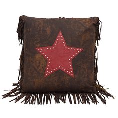 a brown and red pillow with a star on it