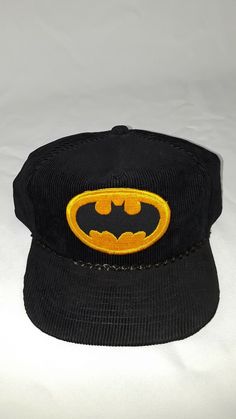 -Welcome to TheSunshineLoft! We specialize in providing our Customers with Vintage, High End, Pre-Owner and New Items at an Affordable Cost! If you have any questions or concerns please do not hesitate to contact us.  THIS LISTING IS FOR:  1964 DC Comics VTG Batman Black Corduroy SnapBack Hat Rare Trucker Hipster Cap. Condition is Pre-owned. Shipped with USPS First Class. Pictures  Please keep in mind there may be some degree color variation between pictures and the actual item du Vintage Black Baseball Cap With Flat Bill, Retro Black Baseball Cap, Retro Corduroy Snapback Baseball Cap, Vintage Black Flat Bill Hat, Retro Corduroy Snapback Hat, Retro Corduroy Hat For Streetwear, Retro Corduroy Flat Bill Hat, Vintage Corduroy Hat For Streetwear, Vintage Black Flat Cap