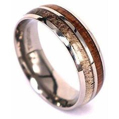 a wedding ring with two wood inlays