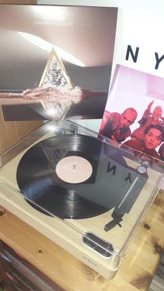 an old vinyl record player is on display