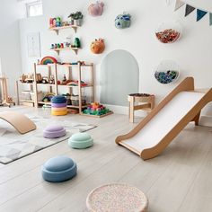 a child's play room with various toys on the floor