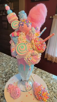 a vase filled with candy and candies on top of a table