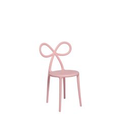 a pink chair with a bow on the back