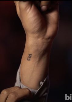 a person with a small tattoo on their arm