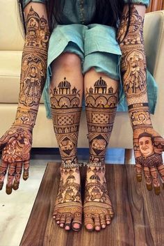 the legs and feet of a woman with henna tattoos