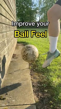 a person kicking a soccer ball in the grass near a house with text overlay that reads, improve your ball feel