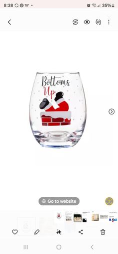 a wine glass with the words, bottoms up on it and a santa clause sitting in a sleigh