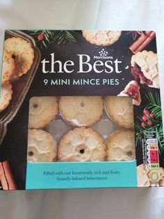 a box of mini mince pies with frosting and cinnamon on the inside