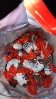 a bag filled with chocolate candies sitting on top of a table