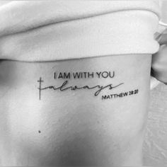 a woman's stomach with the words i am with you written in cursive font