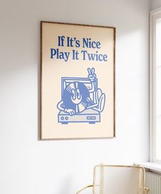 a poster hanging on the wall above a chair