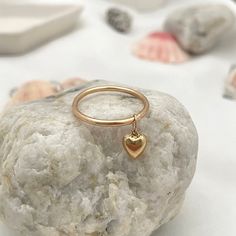 Our Dangling Heart Ring ring is sweetness in a ring, you'll love looking at it all day long while going about your business... wear it in a fun stack or if you're a lover of all things minimalistic you'll rock it alone. Each and every ring is hand-made in our studio at the time of order in sterling silver or 14kt gold fill gold filled wire and features a gorgeous 6mm dangling puffy heart charm. You're going to love creating your custom stack! All of our rings are handmade to order just for you i Puffy Heart Charms, Stone Feature, Business Wear, Puffy Heart, Turks And Caicos, Gold Filled Jewelry, Caicos Islands, Ring Ring, Seychelles