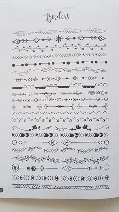 an open notebook with black and white designs on it