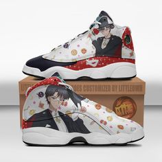 the shoes are decorated with anime characters on them, and have been placed on top of a cardboard box