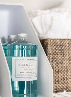 a bottle of water sitting on top of a shelf