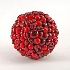 a close up of a red object on a white surface