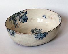 a white bowl with blue flowers on it