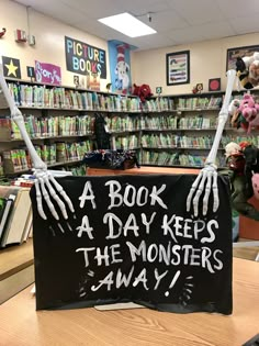 Haunted Library Trunk Or Treat, Halloween Display Case School, Window Display Halloween, Halloween Book Displays Library, Magic Halloween Decor, Book Return Box Ideas, Spooky Library Displays, Fantasy Book Display Library, Halloween At The Library