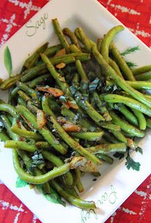 cooked green beans in a white dish on a red tablecloth