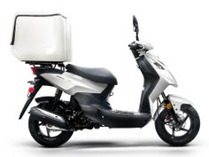 a white and black scooter is shown with the seat up on it's back end