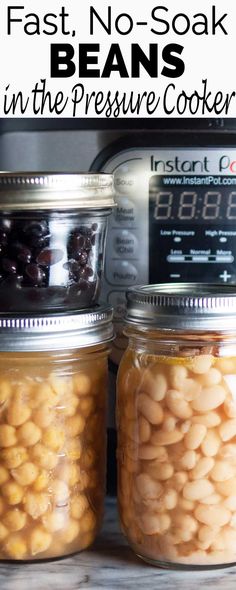 two jars filled with beans next to an instant pressure cooker