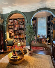 a living room filled with furniture and bookshelves