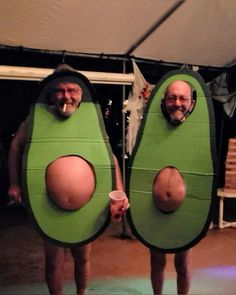 two men are dressed as peas and one is holding a cup