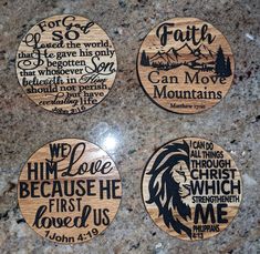 four wooden coasters with bible verses on them sitting on a granite countertop