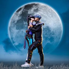 two people standing in front of a full moon with their arms wrapped around each other