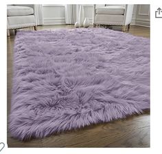 a purple rug on the floor in a living room