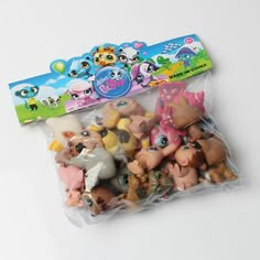 the littlest pet shop toys are in plastic bags