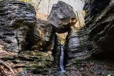 a small waterfall in the middle of some rocks