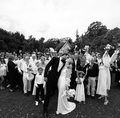 a large group of people standing around each other