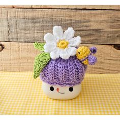 Marshmallow mug hat handmade crochet in a beautiful purple. The purple mug hat has a white flower & leaves with a yellow & purple bumble bee. Handmade home accents created for your summer & spring enjoyment to display on tiered trays. Mug not included. Bumble Bee Flower, Purple Mug, Bee Flower, Flower Leaves, Bee On Flower, Hat Handmade, Tiered Trays, Yellow Purple, Cute Mugs