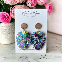 These Glitter Palm Leaf Dangle Drop Earrings provide a unique and stylish way to accessorize any look. They feature a glittery palm leaf design that screams luxury and confidence. Perfect for any occasion, you'll be sure to sparkle and shine with these eye-catching earrings. Size: 5.5cm x 3.9cm * Free Domestic Shipping On All Orders Over $60   * Worldwide Shipping   * 4-interest free payments via AfterPay Fun Resin Dangle Earrings, Fun Resin Drop Earrings, Playful Resin Dangle Earrings, Multicolor Resin Teardrop Earrings, Multicolor Teardrop Resin Earrings, Laser Cut Jewelry Acrylic, Rose Gold Christmas Tree, Palm Leaf Design, Rose Gold Christmas