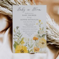 Baby in bloom shower invitation featuring yellow wildflowers, pastel hues, and sage green accents for a whimsical, gender-neutral celebration. Spring Baby Shower Invitations, Garden Baby Shower Theme, Garden Baby Showers, Yellow Wildflowers, Baby In Bloom, Bloom Baby, Floral Baby Shower Invitations, Wedding Mugs, Baby Shower Flowers