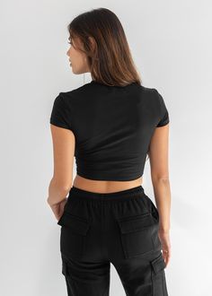 Cap sleeve baby rib crop top. Model is wearing size small. Rib Crop Top, Cargo Sweatpants, Ribbed Crop Top, Stretch Shorts, Soft Shorts, Staple Pieces, Top Model, Baby Tee, Polished Look