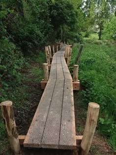 an old wooden bridge in the woods