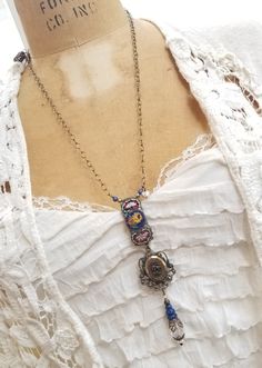 Keep your loved one close to your heart!.... This striking assemblage necklace features a 4 5/8" long three part pendant made of a link from a vintage Italian micro mosaic bracelet, a functional vintage locket, and a vintage crystal adorned with vintage filigree and lapis beads. The 24 1/2" long chain can be worn long, or as short as you would like. A tiny silvertone heart charm adorns the vintage brass chain.   My new vintage jewelry makes a great gift for Christmas, a birthday or an anniversary....or just buy it for yourself. Please take a look at the other unique locket necklaces in my shop!  :)   I have included free insured First Class shipping within the USA which will take 4-5 days.  If you need faster delivery you can upgrade to a faster option for an additional charge.    Please l Blue Bohemian Necklace With Vintage Charm, Unique Locket Necklace, Mosaic Bracelet, Unique Locket, Locket Necklaces, Found Object Jewelry, Micro Mosaic Jewelry, Mosaic Jewelry, Vintage Locket