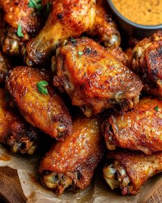 chicken wings with dipping sauce on the side