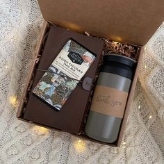 a cup, book and coffee in a gift box