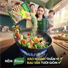 a woman pouring rice into a pan filled with vegetables