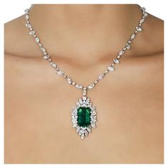 18k White gold necklace with one 19.42 carat very fine emerald and 54 Marquis cut and 55 round brilliant cut diamonds weighing approximately 25.00 carats. Diamond Jewelry Set, White Gold Necklace, Peridot Necklace, Emerald Necklace, White Gold Necklaces, Silver Jewelry Fashion, Tinker Bell, Ear Rings, Round Brilliant Cut Diamond