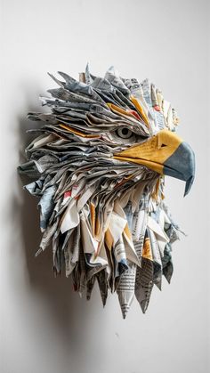 an eagle head made out of newspaper strips