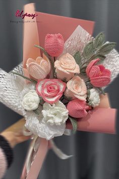 a bouquet of pink and white flowers on a chair