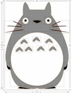 an image of a totoro with eyes and nose cut out on the side