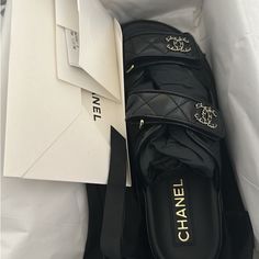 Brand New 2024 Chanel Dad Sandal. Size 38.5 In Black Designer Black Slip-on Mules, Designer Slip-on Sandals With Branded Insole, Luxury Black Flat Mules, Luxury Black Flat Heel Mules, Designer Black Slides For Beach, Luxury Black Flat Slides, Luxury Black Slides For The Beach, Luxury Black Slides For Beach, Black Luxury Flat Slides